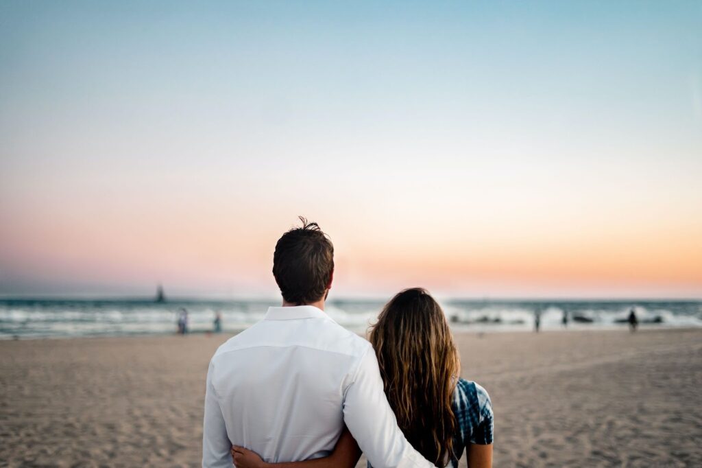 Couple on beach side met through dating service